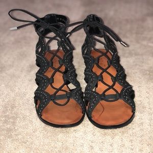 Black heeled gladiator-style shoes